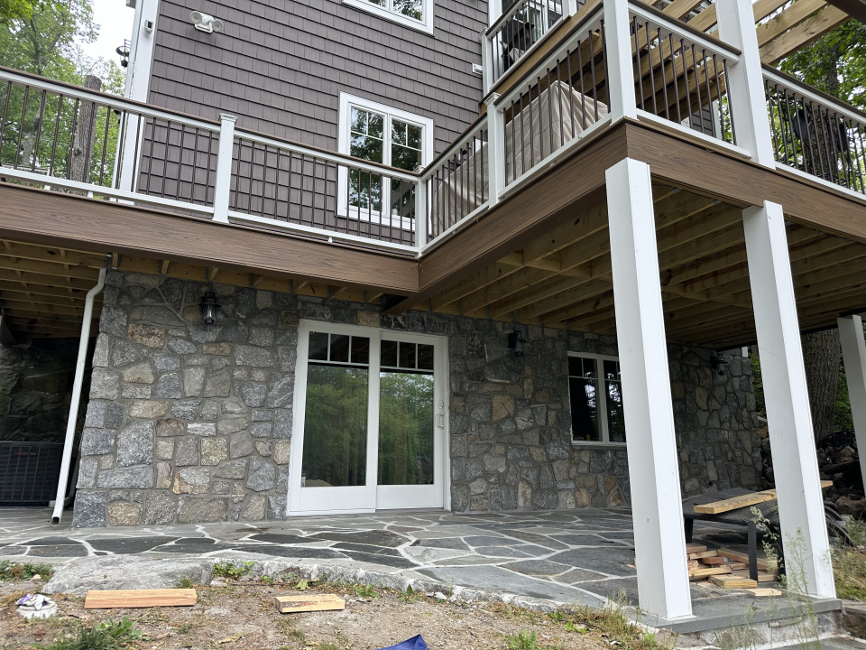 Stone masonry facade with wood deck construction by Al-Pro Construction LLC in Oakland, NJ